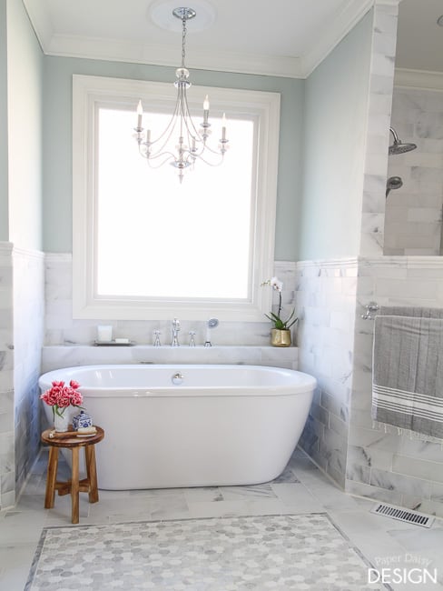 Free standing tub in marble tile master bath/PaperDaisyDesign.com