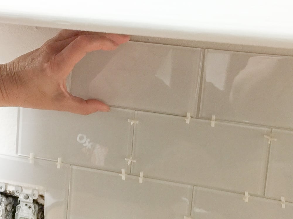 how to adhere peel and stick tiles for backsplash