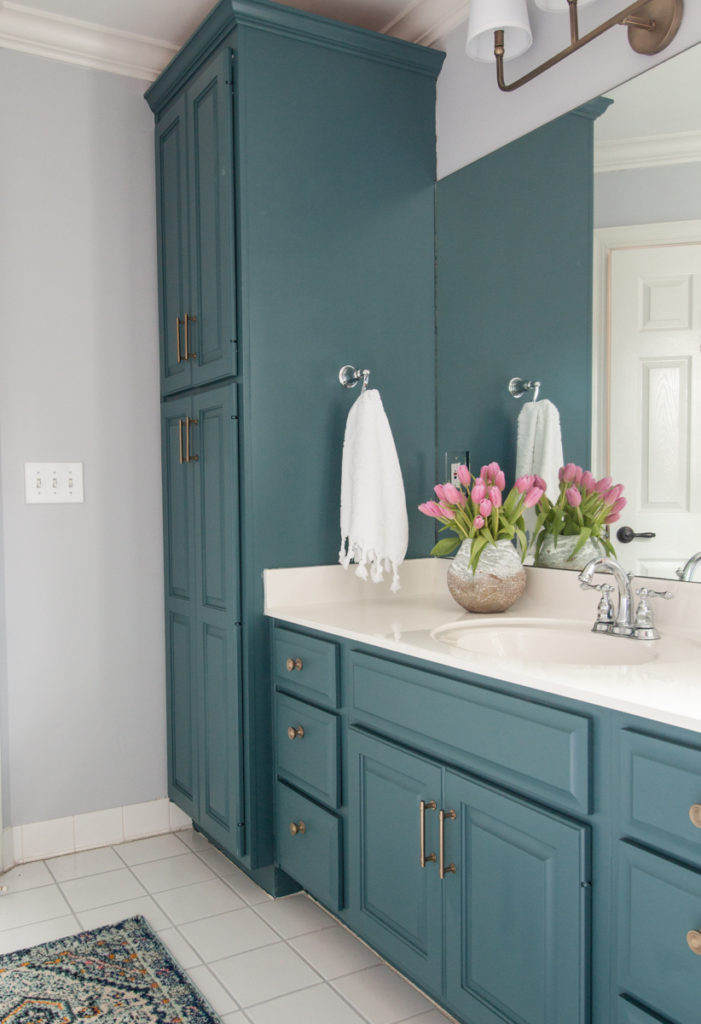 bold color in bathroom. painted cabinets
