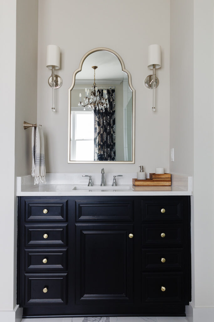 My moody black bathroom in the making. Please ignore the counter clutter  and parts I need to touch up with paint. The lighting is also much warmer  in person & I am