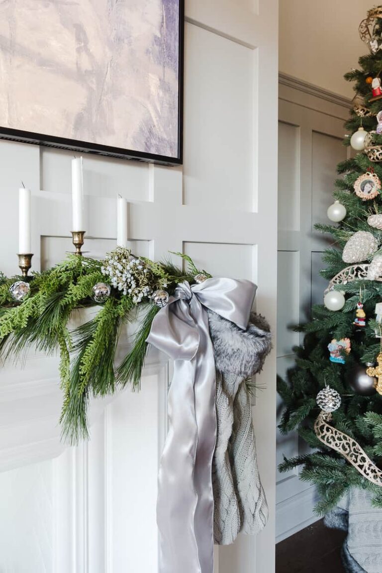 Christmas Mantel Mixing Faux and Fresh Greenery with grey accents