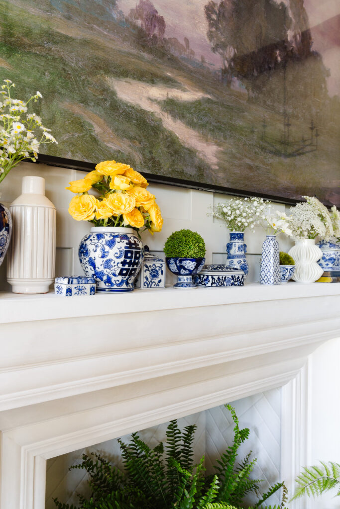 blue and white porcelain on mantel styled for summer