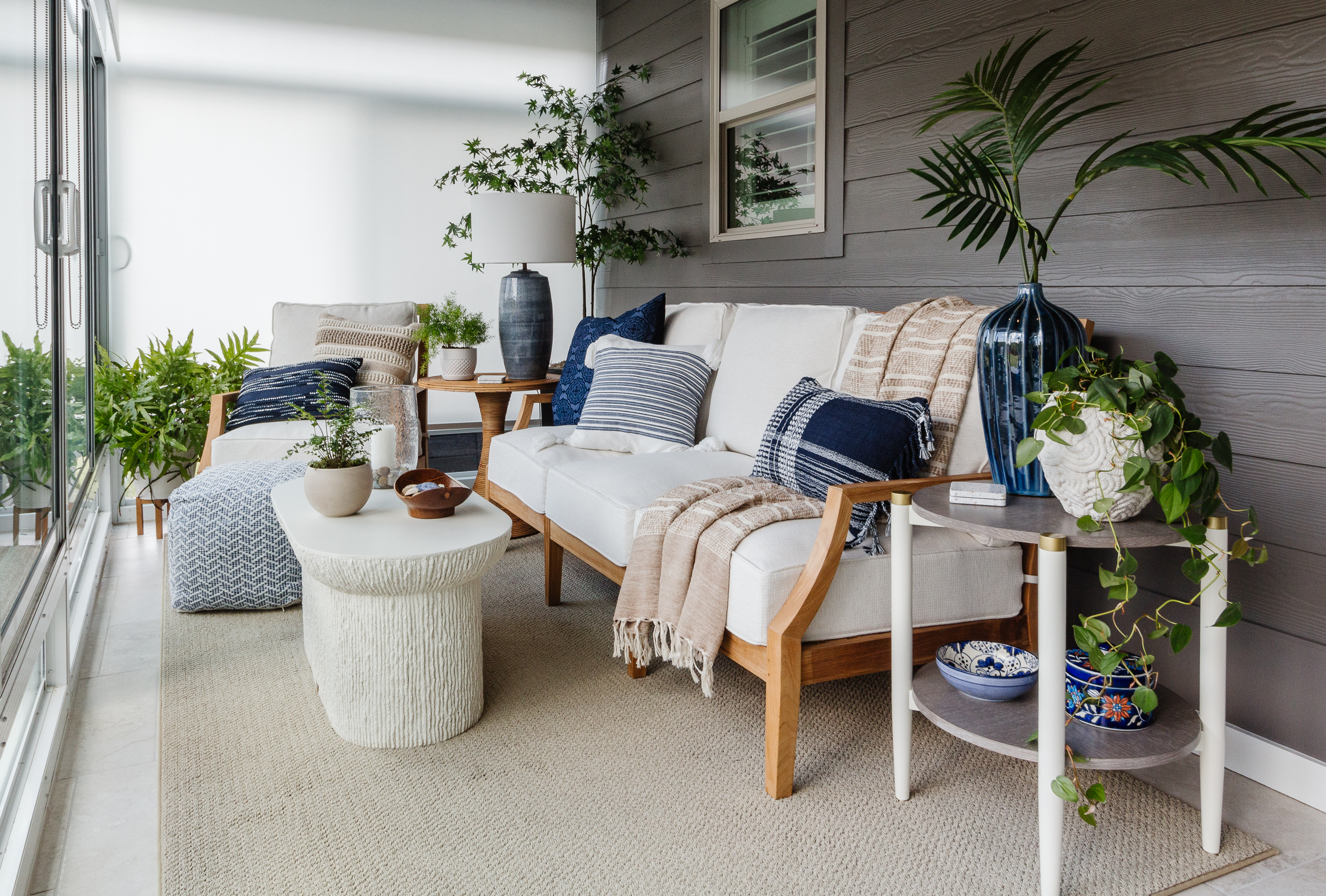 Sunroom blue and white accents with teak