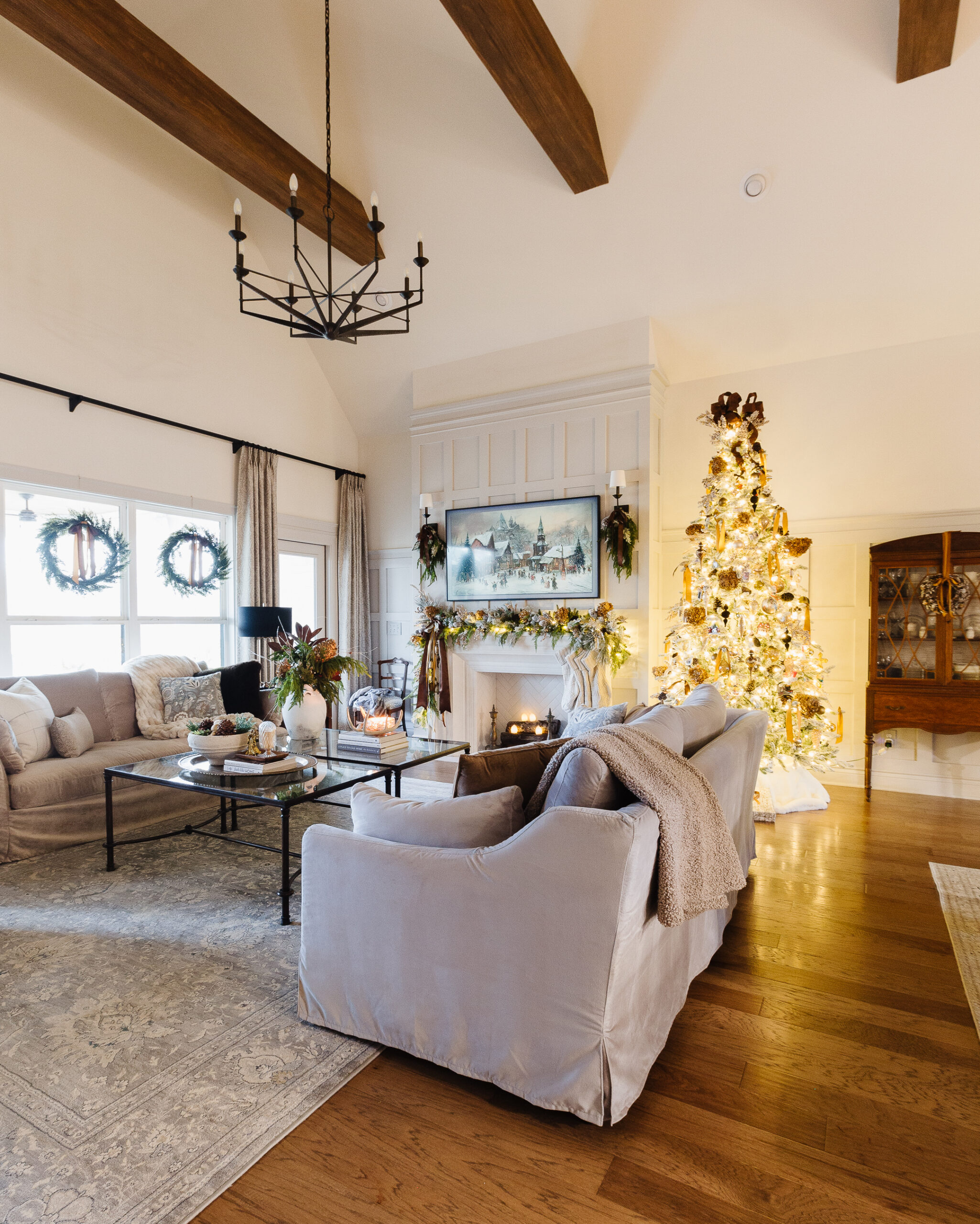 vaulted living room with brown and gold christmas decor