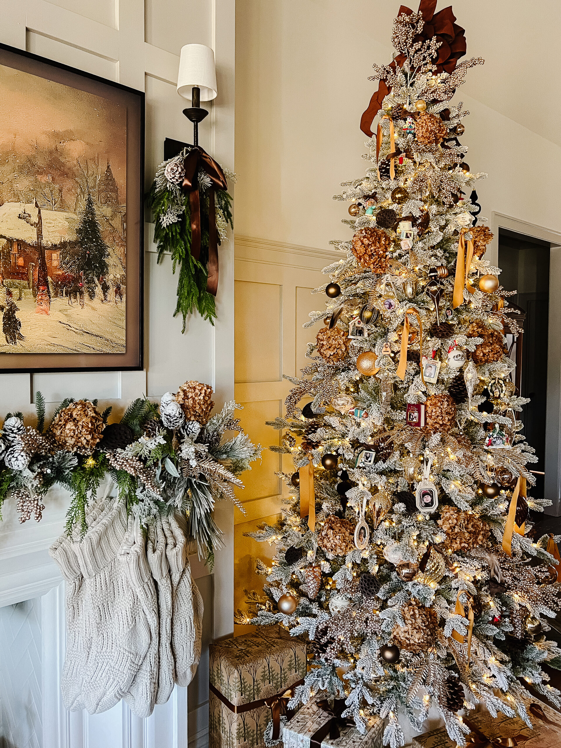 flocked christmas tree with brown and gold accents, dried hydrangeas and branches